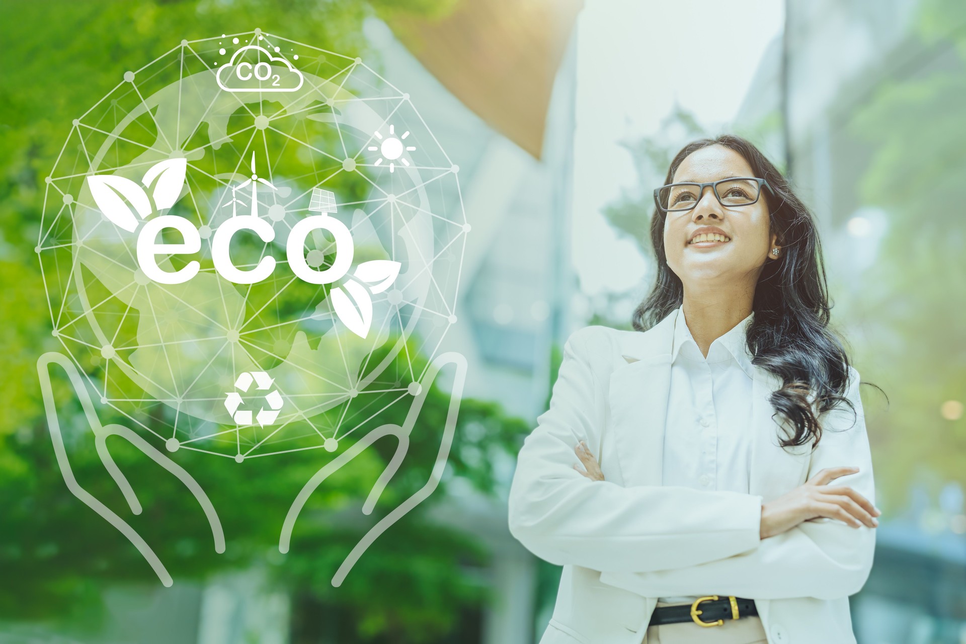 Asian India business success working women standing with proud at green city office building overlay eco saving graphics concept.